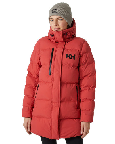 Helly Hansen Adore Ladies Puffy Parka on white background #colour_poppy-red