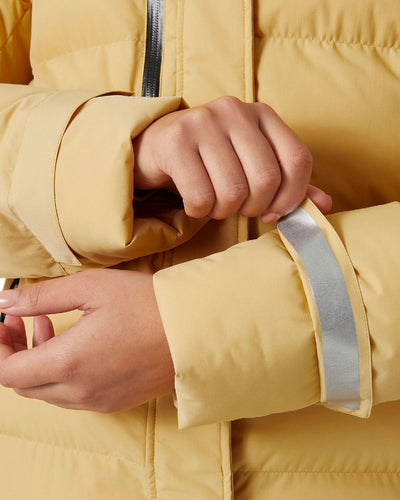 Sand Coloured Helly Hansen Adore Ladies Puffy Parka on white background #colour_sand