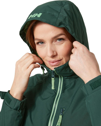 Darkest Spruce coloured Helly Hansen Long Belfast Ladies Winter Jacket on white background #colour_darkest-spruce