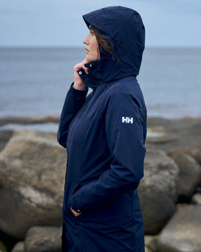 Navy coloured Helly Hansen Womens Aden Long Rain Coat on white background #colour_navy