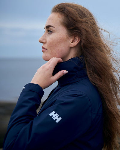 Navy coloured Helly Hansen Womens Aden Long Rain Coat on white background #colour_navy