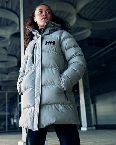 Baby Trooper Helly Hansen Adore Ladies Puffy Parka on wall background #colour_baby-trooper