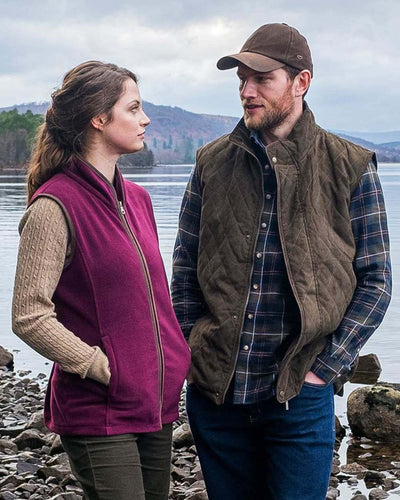 Merlot Coloured Hoggs of Fife Stenton Ladies Fleece Gilet on lake background #colour_merlot