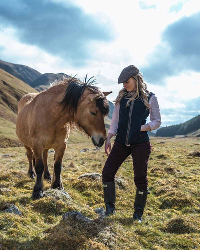 Midnight Navy Coloured Hoggs of Fife Stenton Ladies Fleece Gilet on mountain background #colour_midnight-navy