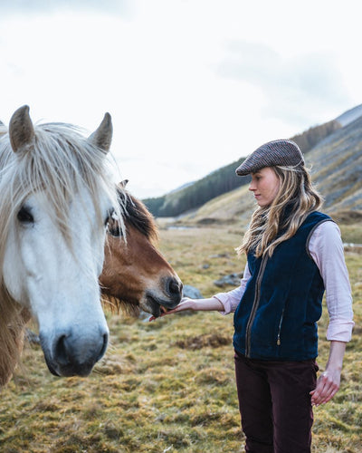 Midnight Navy Coloured Hoggs of Fife Stenton Ladies Fleece Gilet on mountain background #colour_midnight-navy