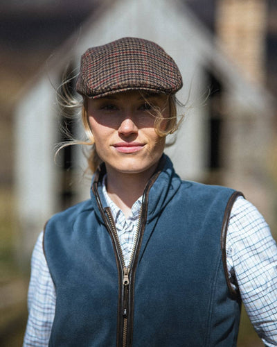 Slate Grey Coloured Hoggs of Fife Stenton Ladies Fleece Gilet on blurry background #colour_slate-grey