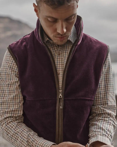 Merlot coloured Hoggs of Fife Stenton Technical Fleece Gilet on blurry background #colour_merlot