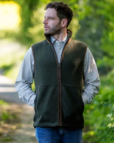 Pine Green coloured Hoggs of Fife Stenton Technical Fleece Gilet on blurry background #colour_pine-green