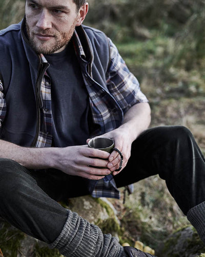 Slate Grey coloured Hoggs of Fife Stenton Technical Fleece Gilet on forest background #colour_slate-grey