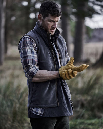 Slate Grey coloured Hoggs of Fife Stenton Technical Fleece Gilet on forest background #colour_slate-grey