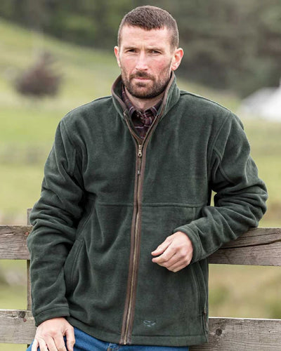 Pine Green Coloured Hoggs of Fife Stenton Technical Fleece Jacket on blurry background #colour_pine-green