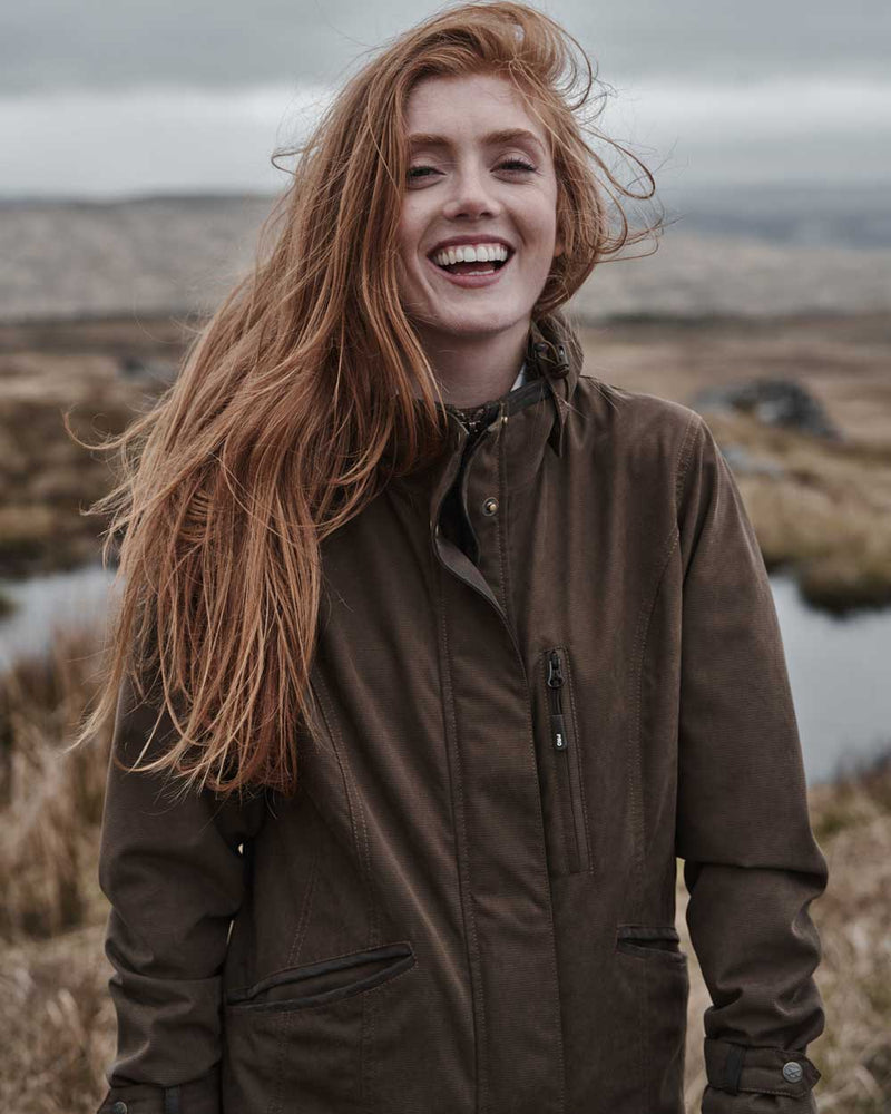 Sage coloured Hoggs of Fife Struther Ladies Long Riding Coat on grassy background 