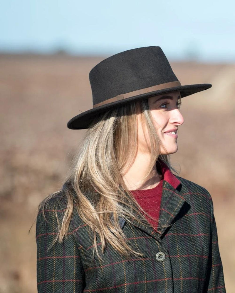 Brown coloured Jack Murphy Boston Crushable Felt Hat on blurry background 