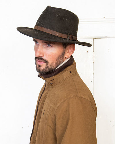 Brown coloured Jack Murphy Boston Crushable Felt Hat on wall background #colour_brown