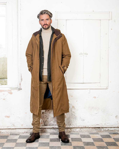 Camel Jack Murphy Emmet Waterproof Long Coat on wall background #colour_camel