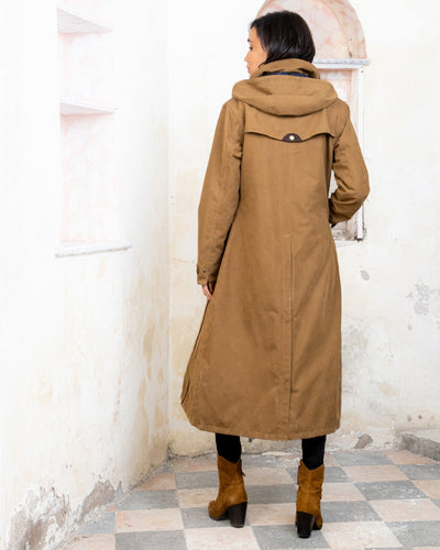 Camel coloured Jack Murphy Erin Long Waterproof Coat on wall background #colour_camel