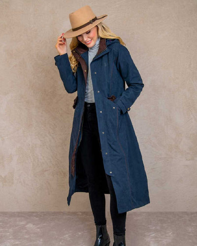 Heritage Navy coloured Jack Murphy Erin Long Waterproof Coat on wall background #colour_heritage-navy