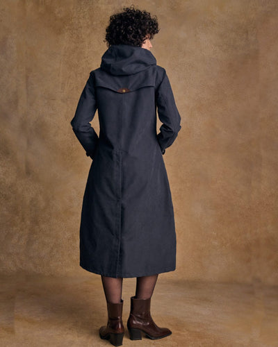 Heritage Navy coloured Jack Murphy Erin Long Waterproof Coat on wall background #colour_heritage-navy