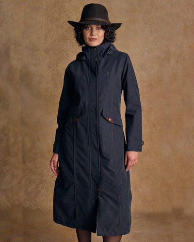 Heritage Navy coloured Jack Murphy Erin Long Waterproof Coat on wall background #colour_heritage-navy