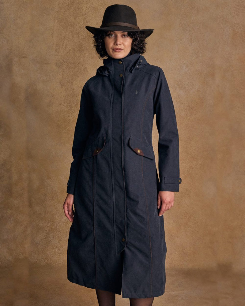 Heritage Navy coloured Jack Murphy Erin Long Waterproof Coat on wall background 