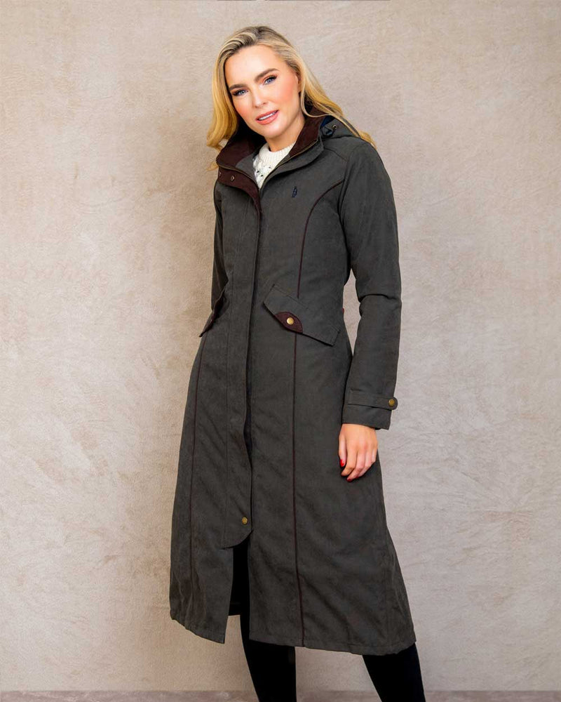 Olive coloured Jack Murphy Erin Long Waterproof Coat on wall background 