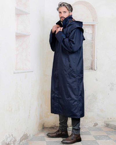 Navy coloured Jack Murphy Lambourne Mens Long Bush Coat on wall background #colour_navy