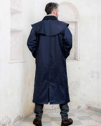 Navy coloured Jack Murphy Lambourne Mens Long Bush Coat on wall background #colour_navy