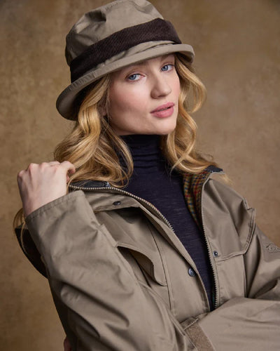 Chinchilla coloured Jack Murphy Malvern Heritage Rain Hat on wall background #colour_chinchilla