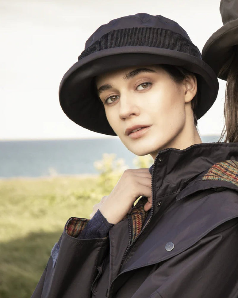 Heritage Navy coloured Jack Murphy Malvern Heritage Rain Hat on sky background 