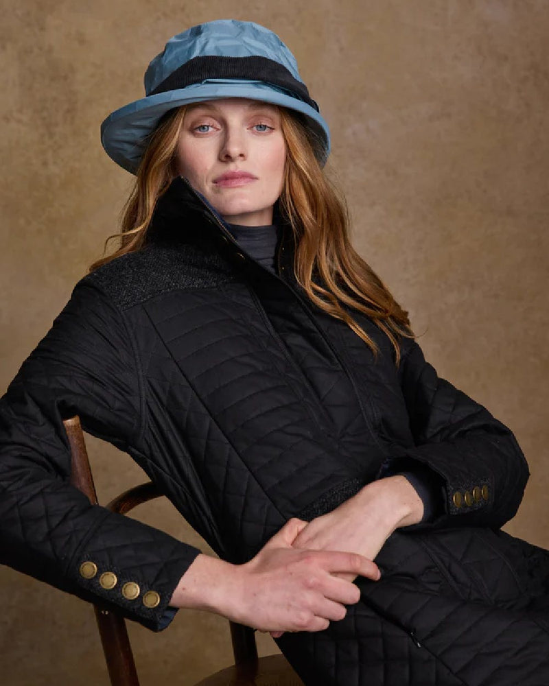 Smoke Blue coloured Jack Murphy Malvern Heritage Rain Hat on wall background 