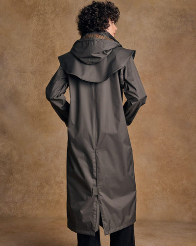 Olive coloured Jack Murphy Malvern Ladies Waterproof Bush Coat on wall background #colour_olive