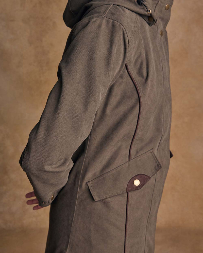 Olive coloured Jack Murphy Una 3/4 Waterproof Coat on wall background 