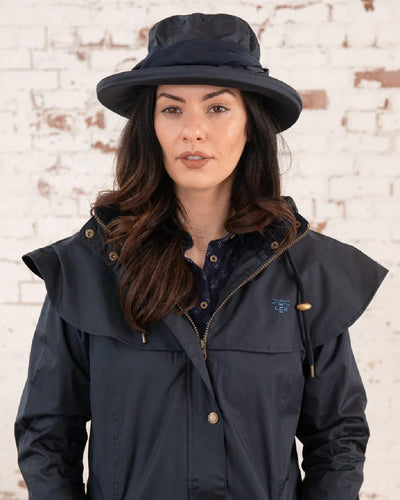 Nightshade coloured Lighthouse Canterbury Waterproof Hat on wall background #colour_nightshade