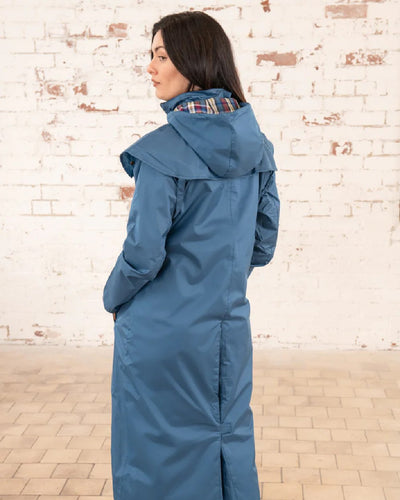 Deep Sea Lighthouse Outback Full Length Ladies Waterproof Raincoat on wall background #colour_deep-sea