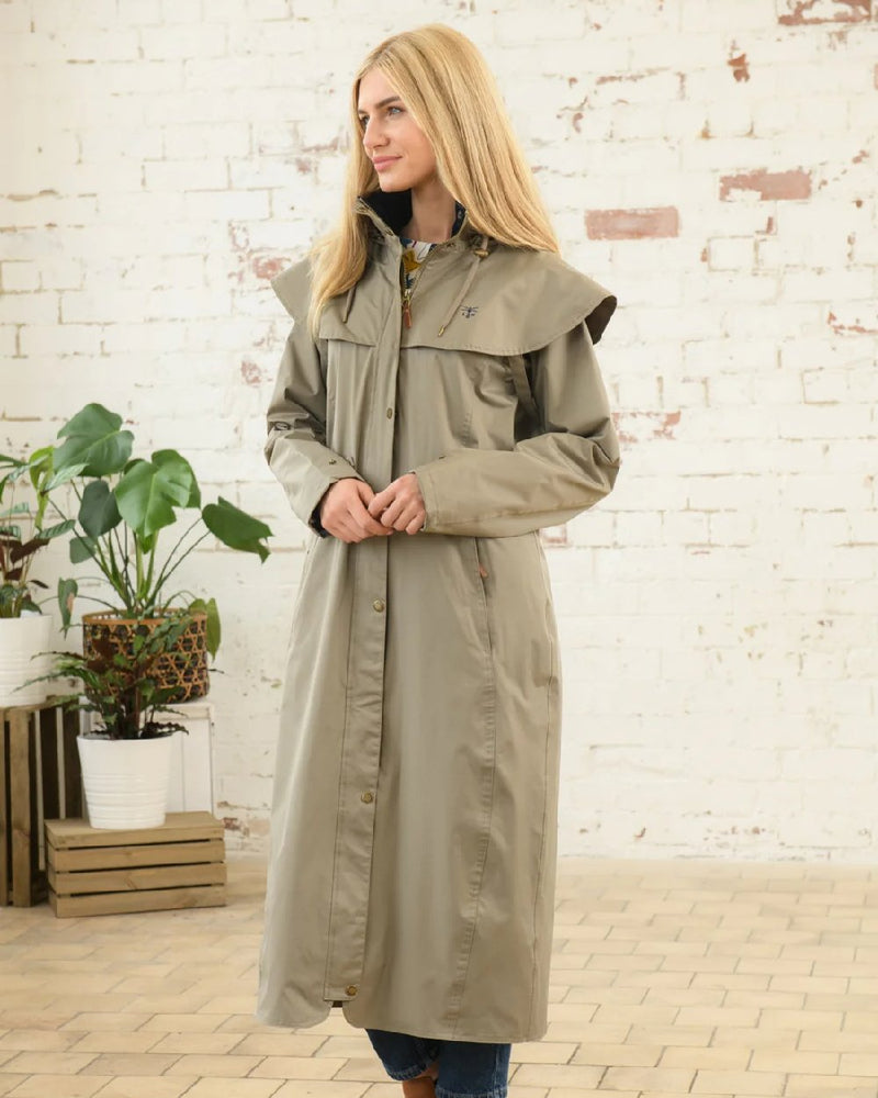 Fawn Lighthouse Outback Full Length Ladies Waterproof Raincoat on wall background 