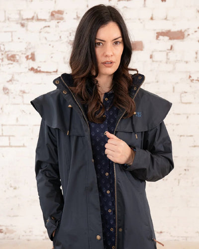 Nightshade Lighthouse Outback Full Length Ladies Waterproof Raincoat on wall background #colour_nightshade