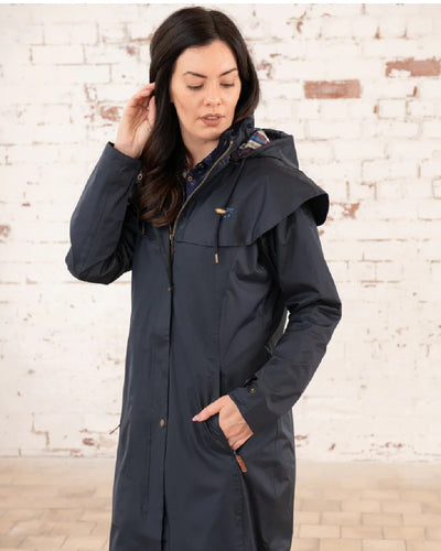 Nightshade Lighthouse Outback Full Length Ladies Waterproof Raincoat on wall background #colour_nightshade