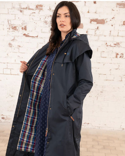 Nightshade Lighthouse Outback Full Length Ladies Waterproof Raincoat on wall background #colour_nightshade