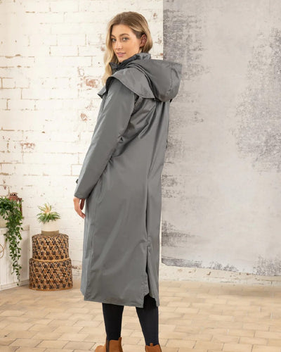 Urban Grey Lighthouse Outback Full Length Ladies Waterproof Raincoat on wall background #colour_urban-grey