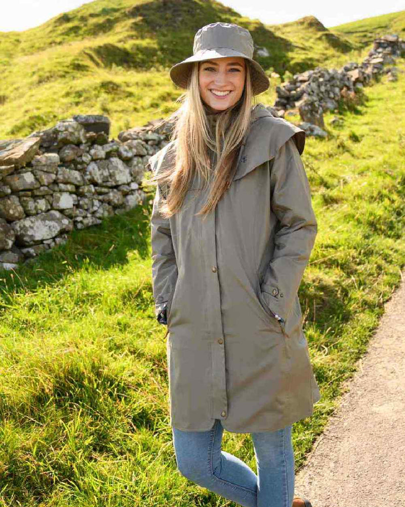 Urban Grey coloured Lighthouse Outrider 3-4 Length Ladies Waterproof Raincoat - Clearance Colours on grassy background 