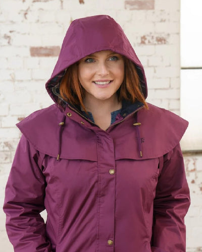 Plum coloured Lighthouse Outrider 3-4 Length Ladies Waterproof Raincoat - Clearance Colours on wall background #colour_plum