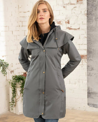 Urban Grey coloured Lighthouse Outrider 3/4 Length Ladies Waterproof Raincoat on wall background #colour_urban-grey