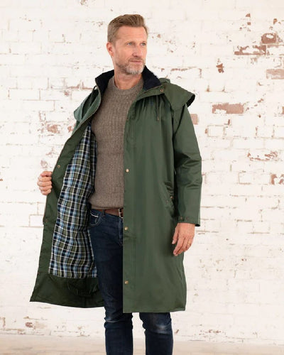 Duffel coloured Lighthouse Long Waterproof Coat on wall background #colour_duffel