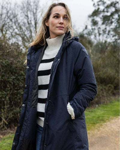 Navy coloured Musto Womens Corsica Primaloft Longline Parka on tree background #colour_navy