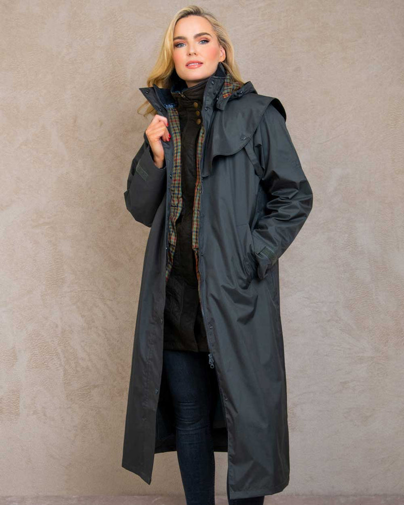 Olive coloured Jack Murphy Malvern Ladies Waterproof Bush Coat on wall background 