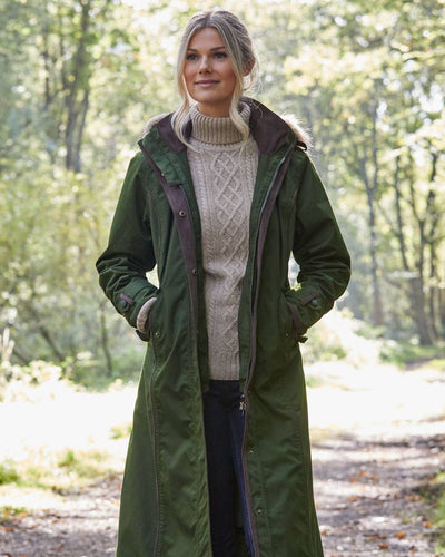 Pesto Coloured Alan Paine Fernley Long Waterproof Coat On A Forest Background #colour_pesto