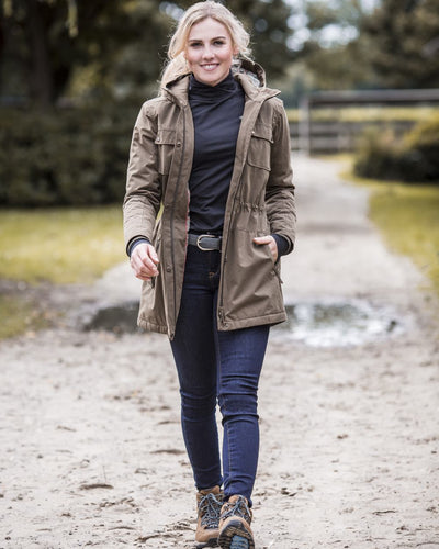 Earth Coloured Ariat Womens Argentium Waterproof Parka On A Street Background #colour_earth