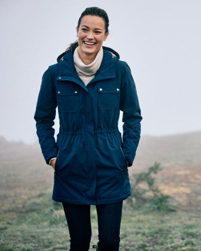 Navy Coloured Ariat Womens Argentium Waterproof Parka On A sky Background #colour_navy