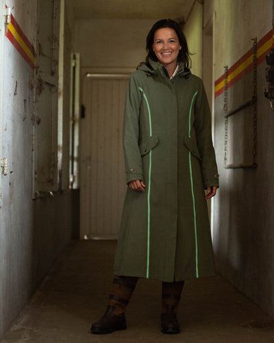 Grey Green Coloured Baleno Kensington Safe Womens Long Riding Coat On A Stable Background #colour_grey-green