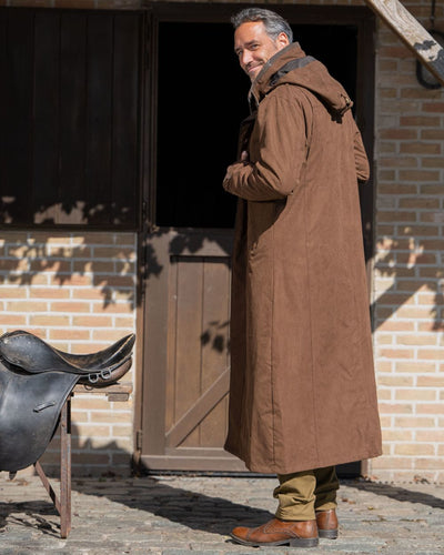 Earth Brown Coloured Baleno Livingstone Long Waterproof Coat On A Backyard Background #colour_earth-brown